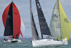 Leading the doublehanders downwind as the first singlehander comes upwind